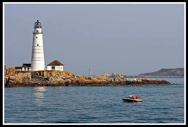 Boston Harbor lighthouse in early morning.