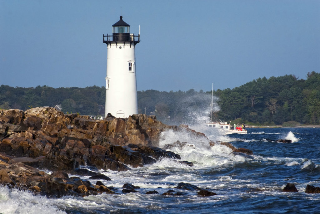 Portsmouth Harbor Lighthouse Guides Mariners Around Rocky Shore