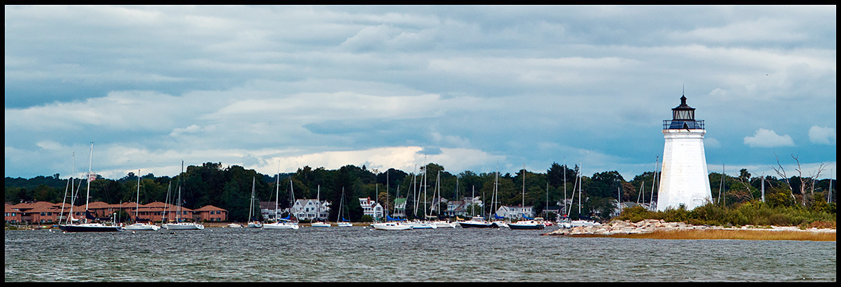 Sun illuminating tower of Black Rock Harbor (Fayerweather Island) light