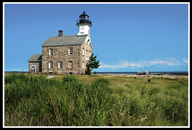 stone architecture of Sheffield Island light on flat terrain on island