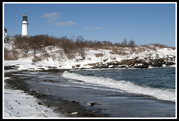 Cape Elizabeth tower over beach