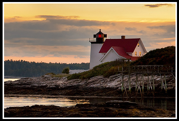 dramtic sunset by Hendricks Head lighthouse