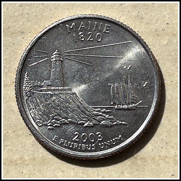 Maine quarter with Pemaquid Lighhouse