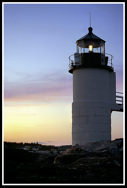 sunset by lighthouse tower