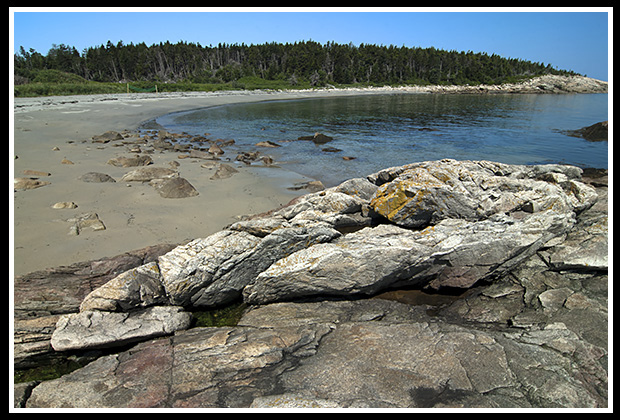 sandy beach on Matinicus Island amid rocky shore