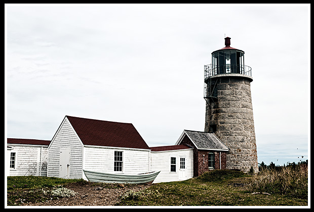 Monhegan Island lighthouse with surrounding buildings