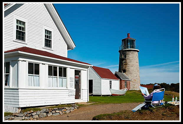 artist paints Monhegan Island lighthouse tower and famous row boat