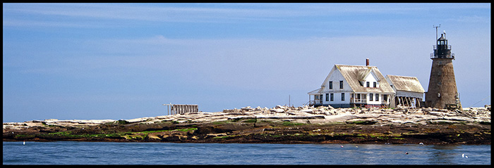 Mount Desert Rock light with buildings ravaged by storms