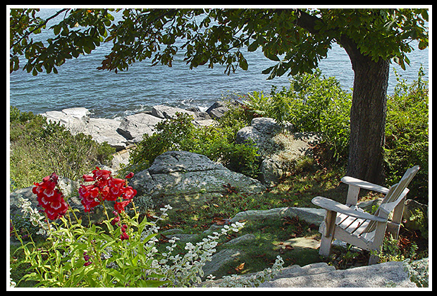 chair along rocky island seashore