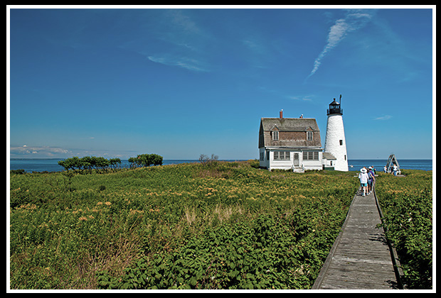 wooden walkway leads to wood island lighthouse