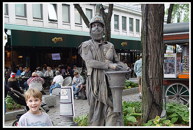live statue in front of surprised boy (my son)
