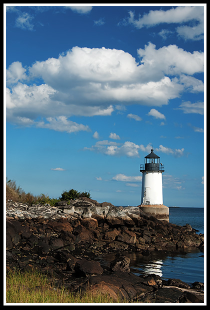 Fort Pickering light with late afternoon sun setting