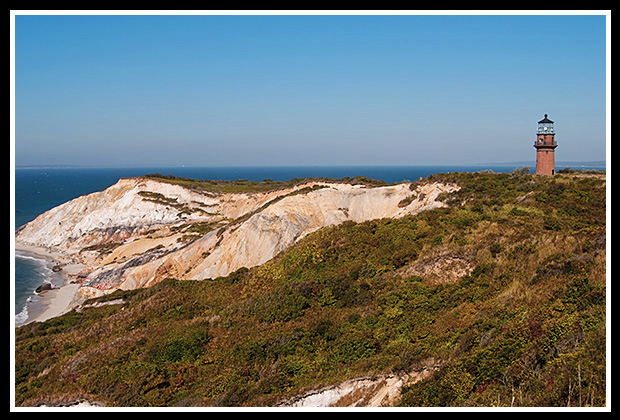 Gay Head lighthouse tower overlooking sandy cliffs