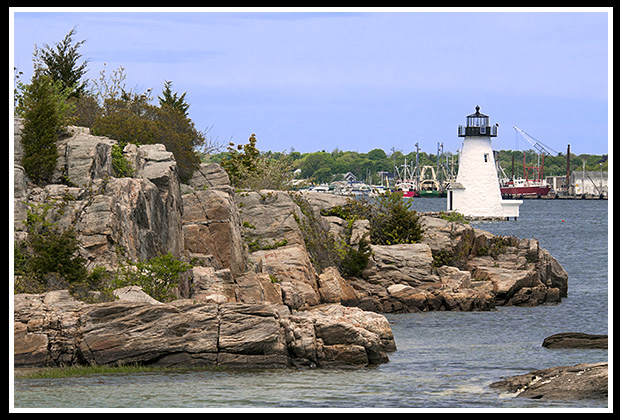 Palmer Island light at other end of hurricane wall in New Bedford Harbor