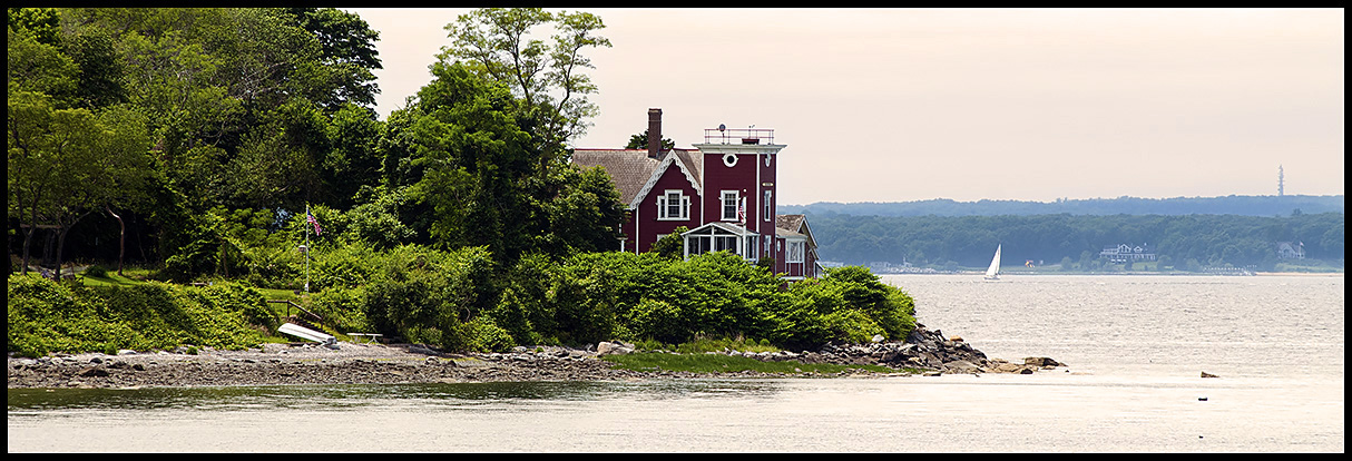 Conanicut Island lighthouse on water's edge 