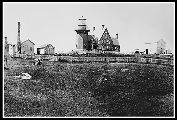 early Block Island Southeast light with surrounding buildings