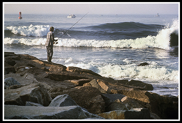 fishing off the shore along watch hill light