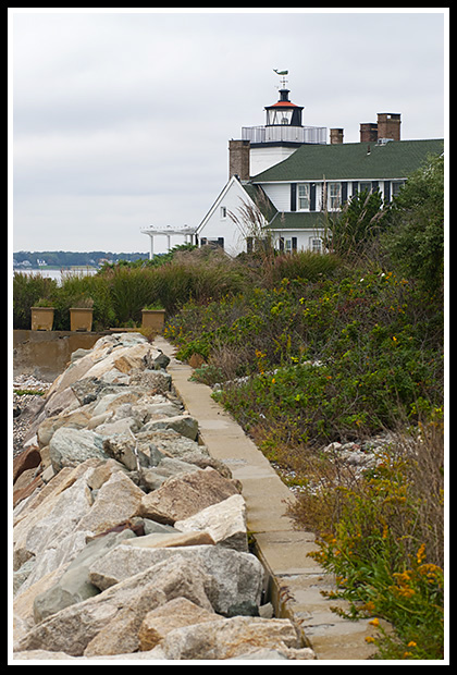 Nayatt Point light along stone wall