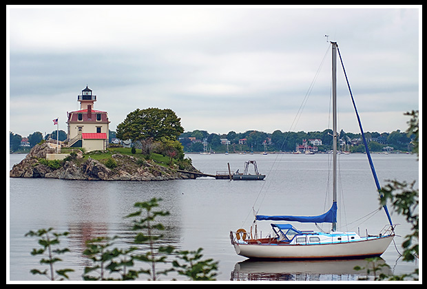 sailboat moored by Pomham Rocks light