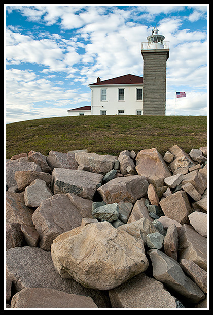 Watch Hill Lighthouse tower and rock seawall